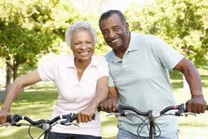 Senior couple smiling outside