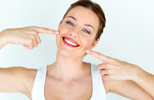 Woman smiling after cost of teeth whitening in St. Augustine 